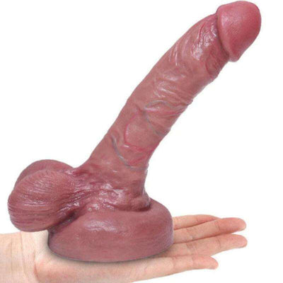 ARMONY realistic liquid silicone dildo, 15 cm, lifelike design in hand.